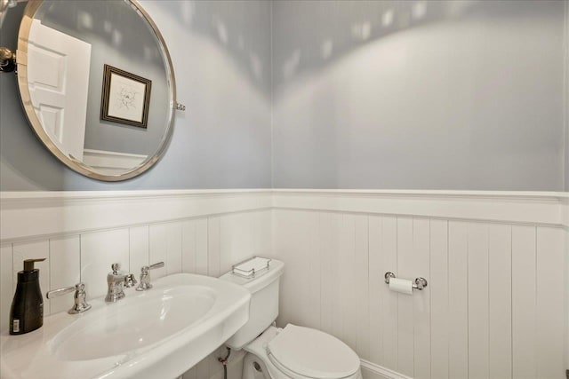 4640 Grove Park Dr, Tallahassee, FL 32311 - bathroom with a sink and wainscoting