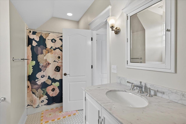 4640 Grove Park Dr, Tallahassee, FL 32311 - full bathroom featuring vanity, tile patterned flooring, lofted ceiling, and a shower with shower curtain