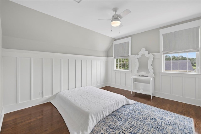 4640 Grove Park Dr, Tallahassee, FL 32311 - bedroom with a decorative wall, wood finished floors, wainscoting, lofted ceiling, and ceiling fan