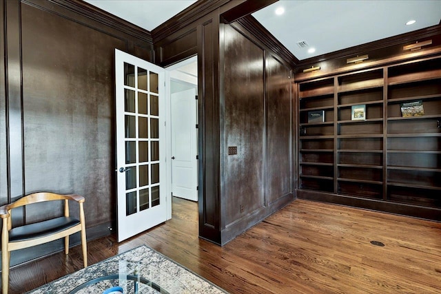 4640 Grove Park Dr, Tallahassee, FL 32311 - unfurnished room featuring ornamental molding, wood finished floors, built in shelves, and french doors