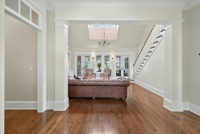 4640 Grove Park Dr, Tallahassee, FL 32311 - living area with stairway, wood finished floors, a chandelier, and lofted ceiling