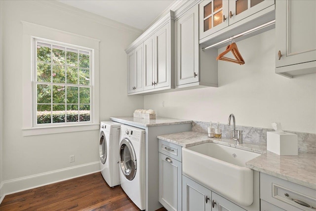 4640 Grove Park Dr, Tallahassee, FL 32311 - washroom featuring cabinet space, washer and dryer, dark wood-type flooring, and crown molding