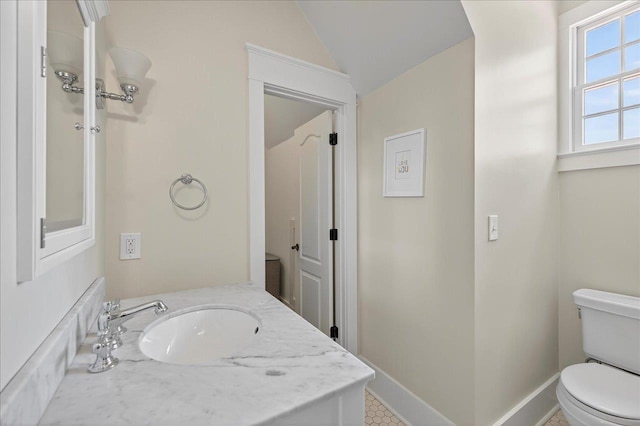 4640 Grove Park Dr, Tallahassee, FL 32311 - bathroom with lofted ceiling and vanity