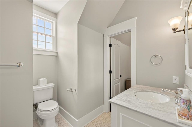 4640 Grove Park Dr, Tallahassee, FL 32311 - bathroom with vanity, vaulted ceiling, and tile patterned flooring