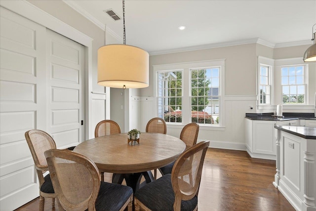 4640 Grove Park Dr, Tallahassee, FL 32311 - dining space with crown molding, dark wood-style floors, a wainscoted wall, and recessed lighting