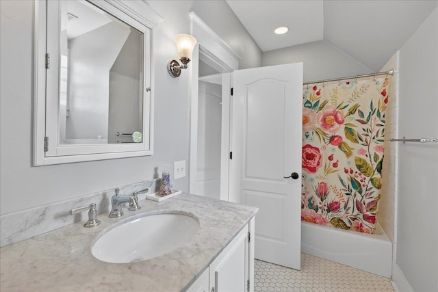 4640 Grove Park Dr, Tallahassee, FL 32311 - bathroom with vanity, shower / tub combo, vaulted ceiling, and tile patterned flooring