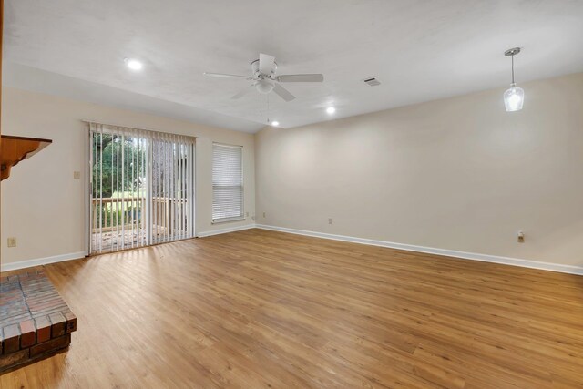 spare room with light hardwood / wood-style floors and ceiling fan