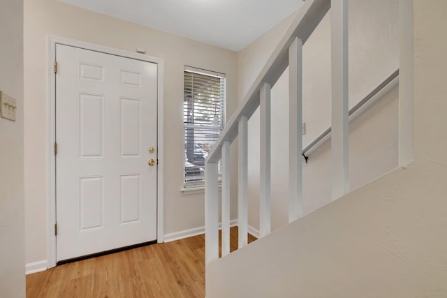 foyer with light hardwood / wood-style floors