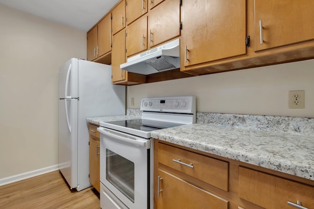 kitchen with light wood-type flooring and white range with electric cooktop