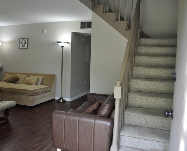 stairway with hardwood / wood-style floors