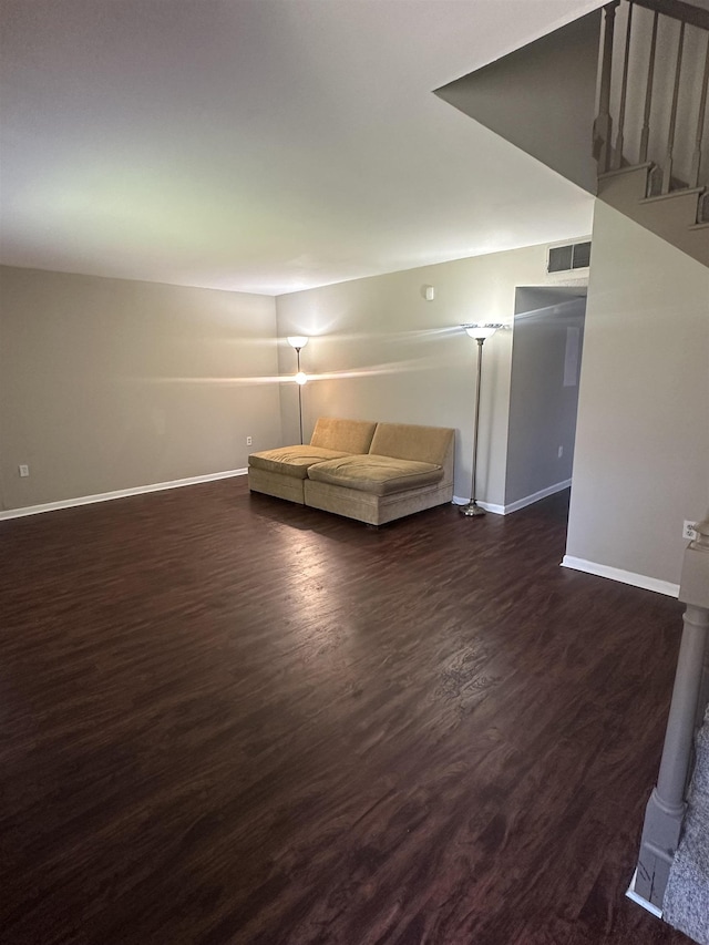 214 Belmont Rd, Tallahassee, FL 32301 - sitting room with baseboards, dark wood-style flooring, and stairway