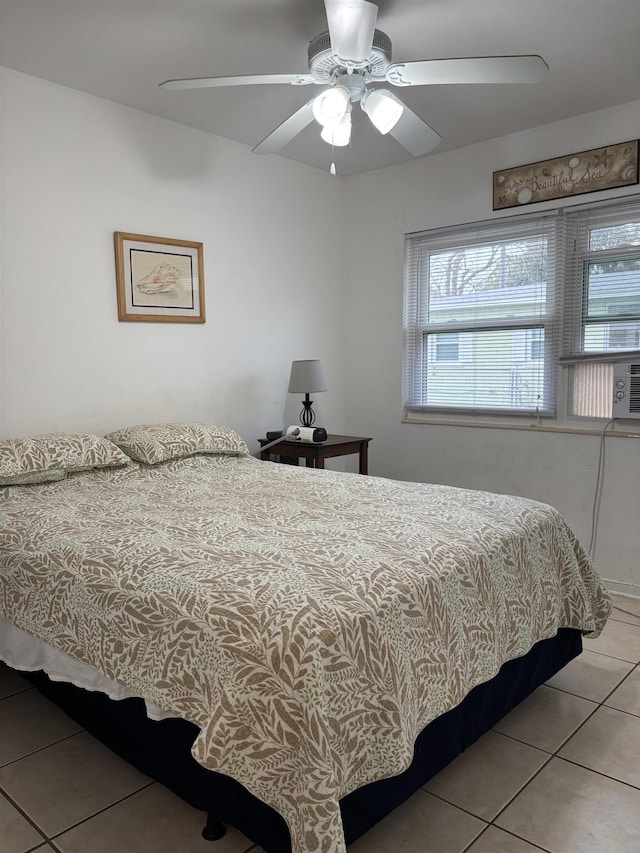 bedroom featuring ceiling fan and light tile patterned floors