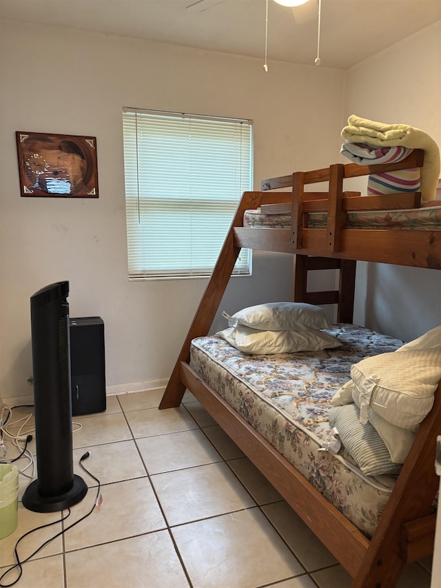 bedroom featuring ceiling fan and light tile patterned flooring