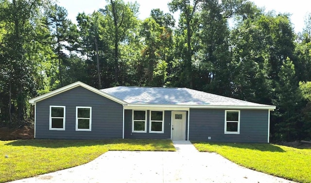 ranch-style home with a front lawn