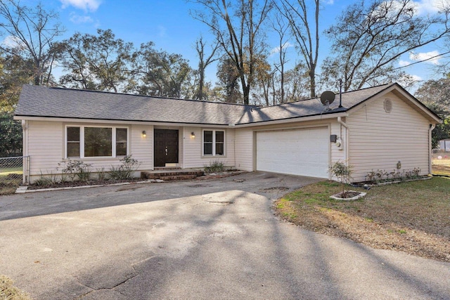 ranch-style home with a garage