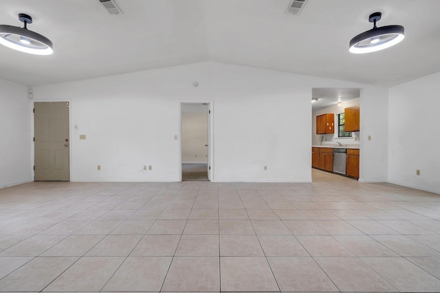 interior space featuring baseboards, visible vents, light tile patterned floors, and lofted ceiling