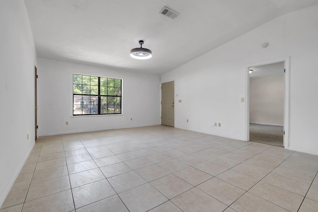 spare room featuring visible vents and light tile patterned floors