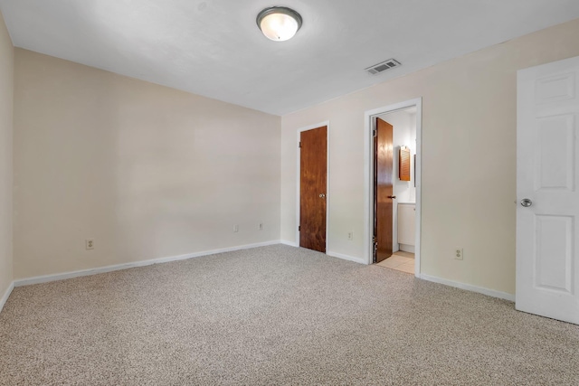 unfurnished bedroom with baseboards, visible vents, and light carpet