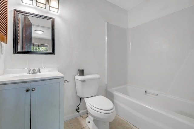 full bath with vanity, toilet, baseboards, tile patterned floors, and shower / washtub combination