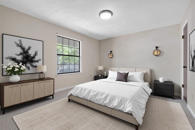 carpeted bedroom with baseboards
