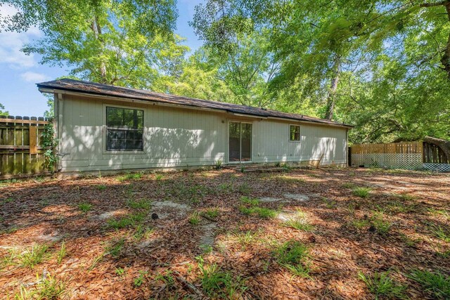 back of property with fence