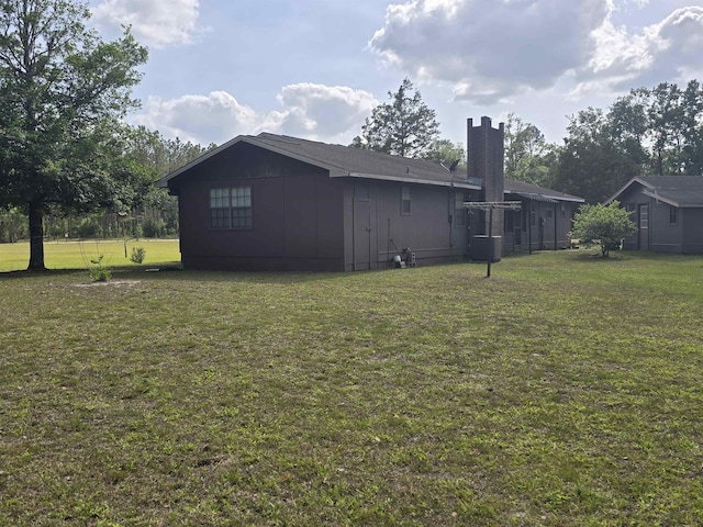 3232 Loren Henderson Rd, Perry, FL 32347 - exterior space with a yard and a chimney