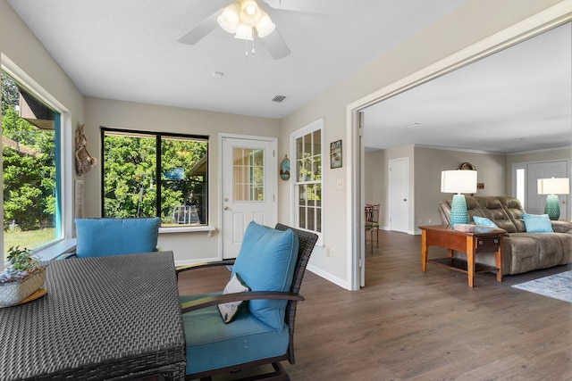 sunroom with a healthy amount of sunlight and visible vents