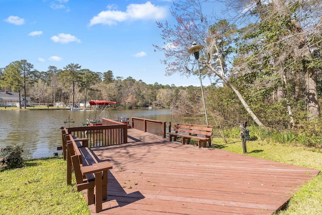 view of dock featuring a water view and a wooded view