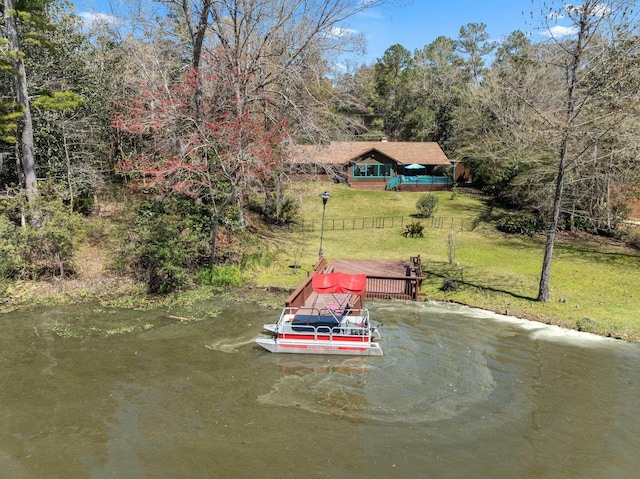 exterior space with a lawn and a water view