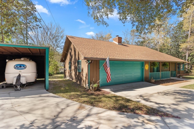 view of front of home featuring a chimney, concrete driveway, board and batten siding, a shingled roof, and a carport