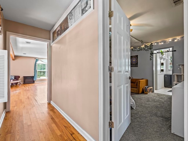 corridor featuring light hardwood / wood-style floors