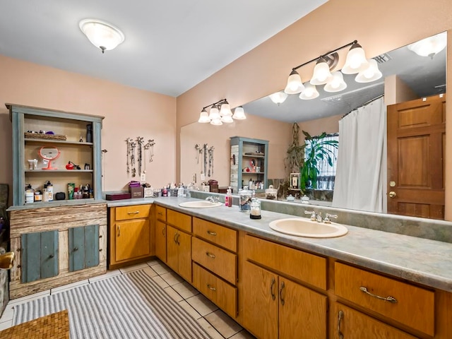 bathroom with vanity and tile patterned flooring