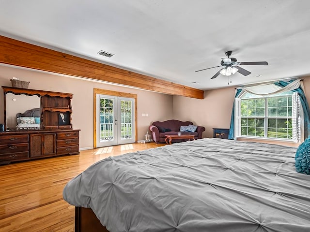 bedroom featuring light wood-type flooring, french doors, ceiling fan, and access to exterior