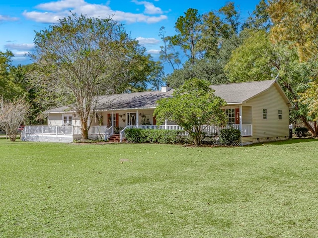 single story home with a porch and a front lawn