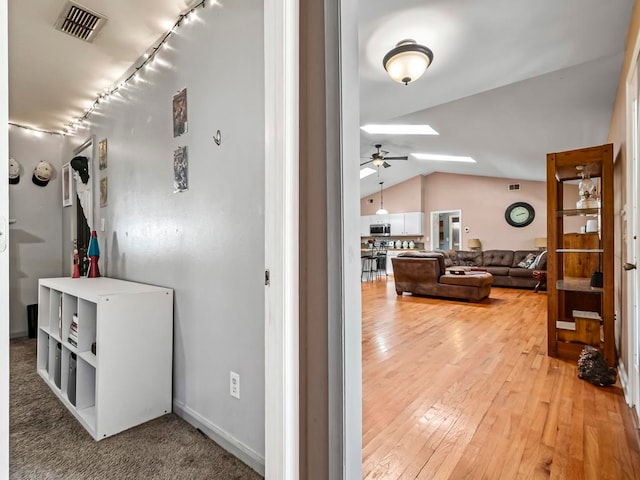 interior space with lofted ceiling and wood-type flooring