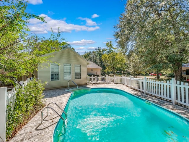 view of pool featuring a patio