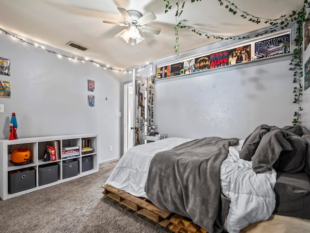 bedroom featuring ceiling fan and carpet