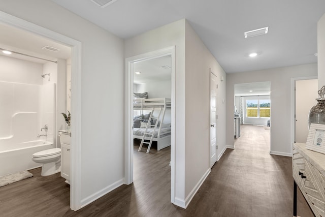 full bathroom with shower / tub combination, toilet, hardwood / wood-style flooring, and vanity