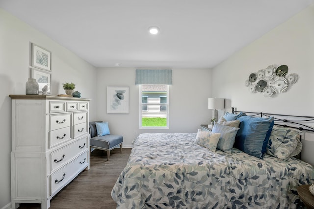 bedroom with dark wood-type flooring