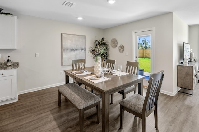 dining space featuring hardwood / wood-style flooring