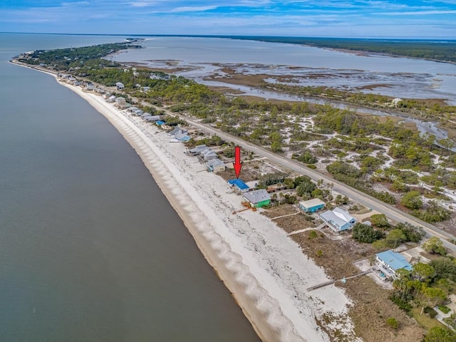 birds eye view of property featuring a water view and a view of the beach