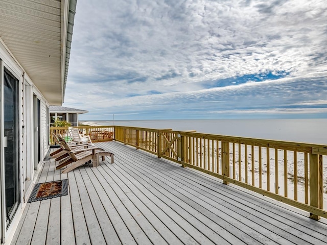 wooden deck featuring a water view