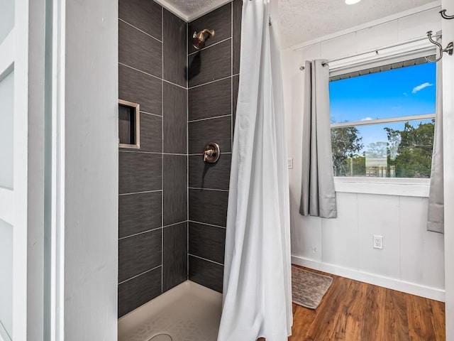 bathroom with hardwood / wood-style floors and a shower with shower curtain