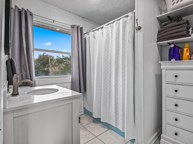 bathroom with vanity, tile patterned floors, a textured ceiling, and a shower with shower curtain