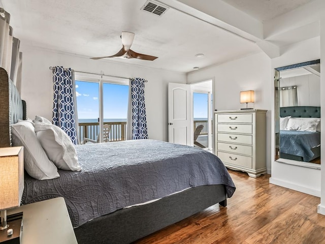 bedroom featuring ceiling fan, hardwood / wood-style floors, and access to outside