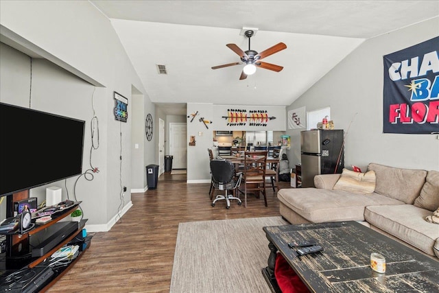 living room featuring a ceiling fan, vaulted ceiling, dark wood finished floors, and baseboards