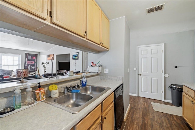 kitchen with black dishwasher, light countertops, visible vents, light brown cabinetry, and a sink