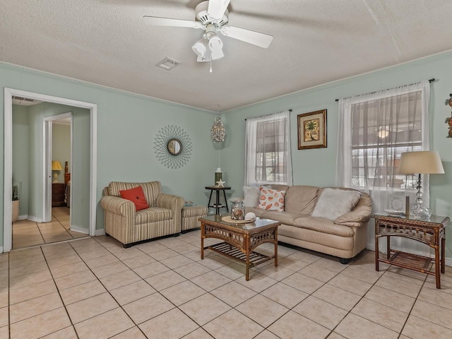 6 Parker Ave Unit 3 & 4, Lanark Village, FL 32323 - living area featuring ornamental molding, ceiling fan, light tile patterned flooring, and a textured ceiling