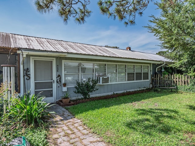 6 Parker Ave Unit 3 & 4, Lanark Village, FL 32323 - view of front of home featuring a front yard and a metal roof