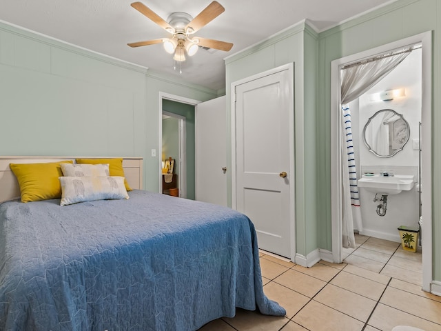 6 Parker Ave Unit 3 & 4, Lanark Village, FL 32323 - bedroom with ornamental molding, light tile patterned floors, and a ceiling fan